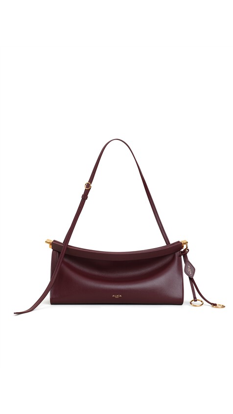 ALA&Iuml;A LE CLICK EAST WEST MEDIUM BAG IN CALFSKIN GARNET RED